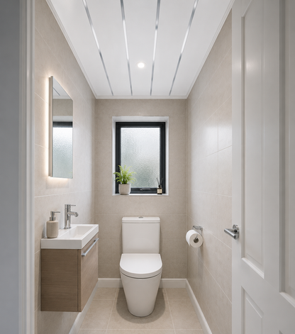 Gloss white chrome strip PVC ceiling panel in a toilet